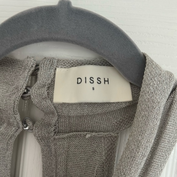 stretchy knit fabrication
Twist halter neckline
Three-button closure at neck - Picture 1 of 4